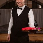 smooth and sexy waiter Kevin White holding tray